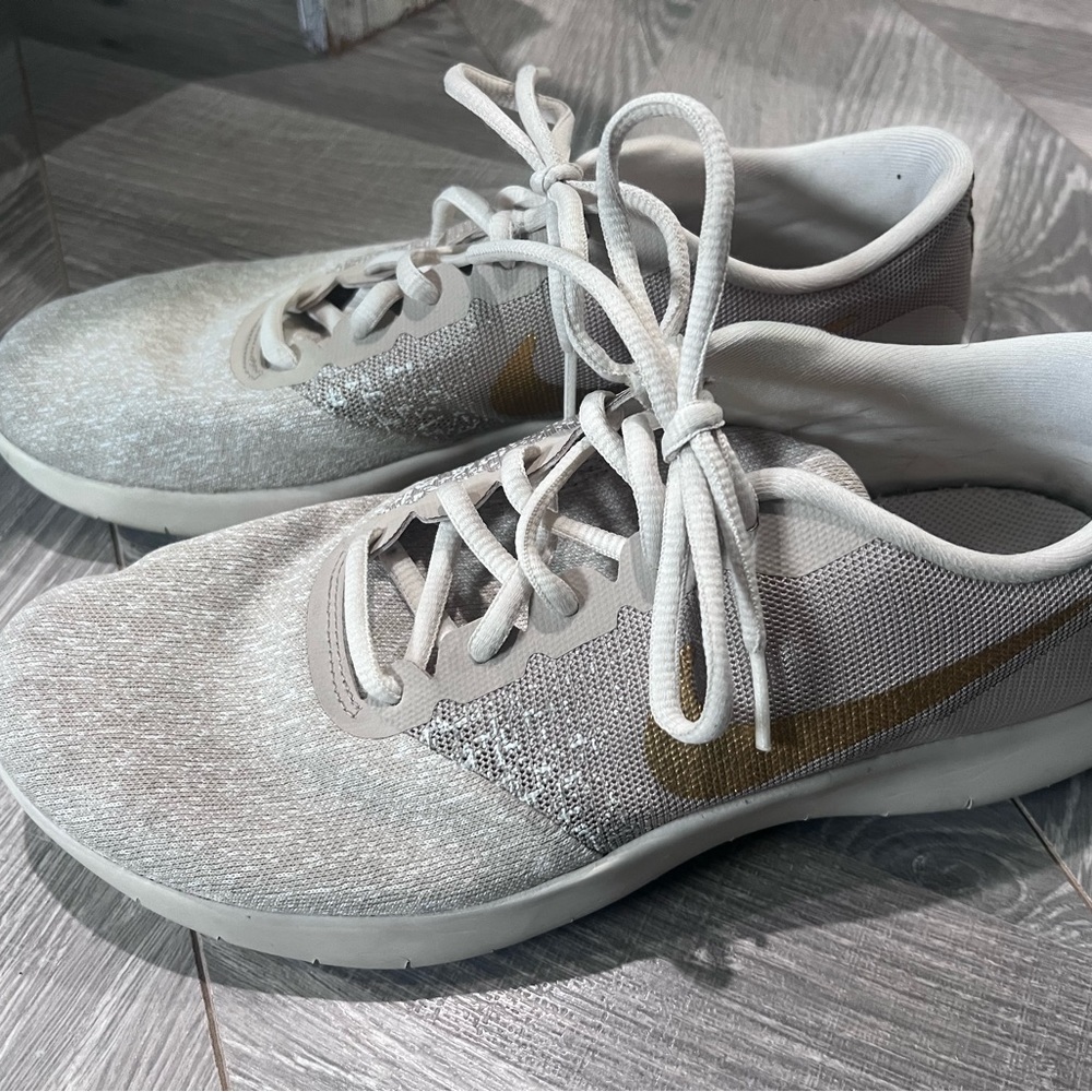 Women’s size 10 Nike sneakers. Khaki/cream with gold swoosh.